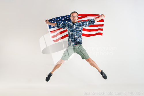 Image of Young man with the flag of United States of America