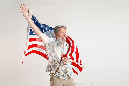 Image of Senior man with the flag of United States of America