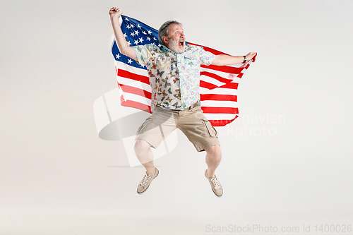 Image of Senior man with the flag of United States of America