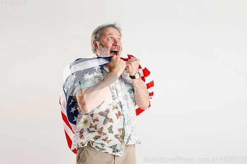 Image of Senior man with the flag of United States of America