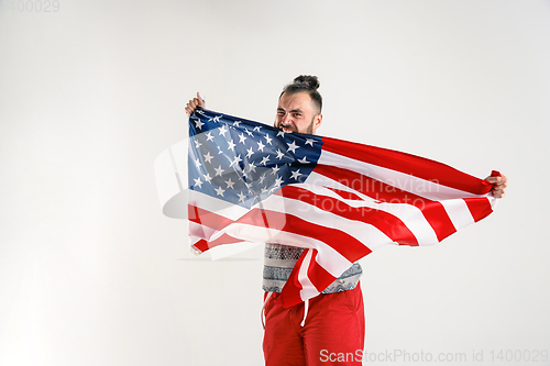 Image of Young man with the flag of United States of America