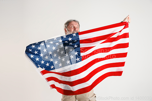 Image of Senior man with the flag of United States of America