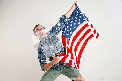 Image of Young man with the flag of United States of America