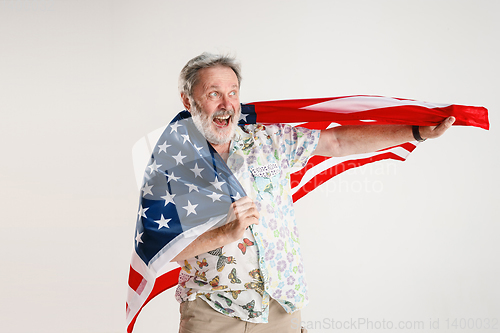 Image of Senior man with the flag of United States of America