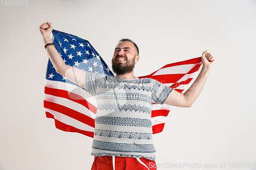 Image of Young man with the flag of United States of America