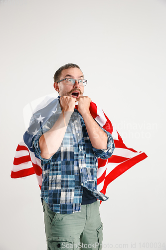 Image of Young man with the flag of United States of America