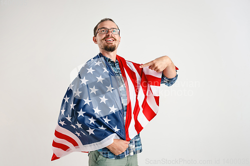 Image of Young man with the flag of United States of America