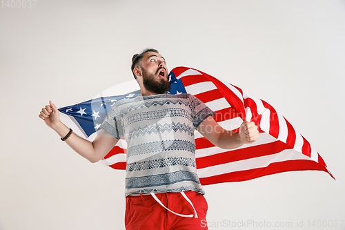 Image of Young man with the flag of United States of America