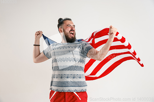 Image of Young man with the flag of United States of America