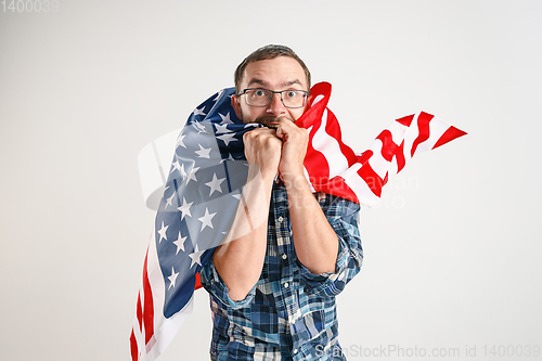 Image of Young man with the flag of United States of America