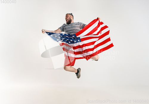 Image of Young man with the flag of United States of America