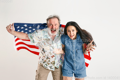 Image of Senior man with the flag of United States of America