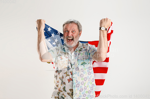 Image of Senior man with the flag of United States of America