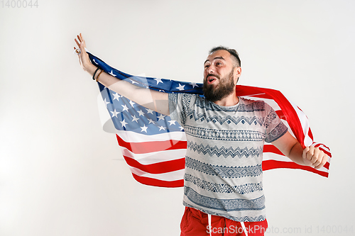 Image of Young man with the flag of United States of America