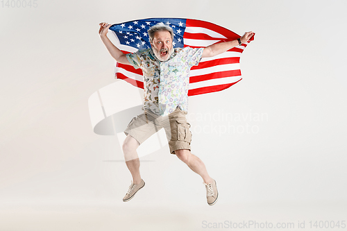 Image of Senior man with the flag of United States of America