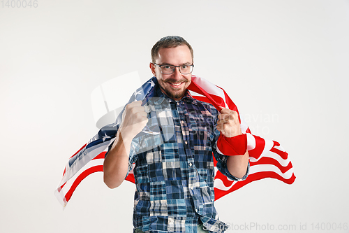 Image of Young man with the flag of United States of America