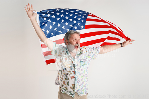 Image of Senior man with the flag of United States of America