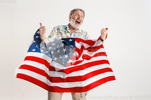 Image of Senior man with the flag of United States of America