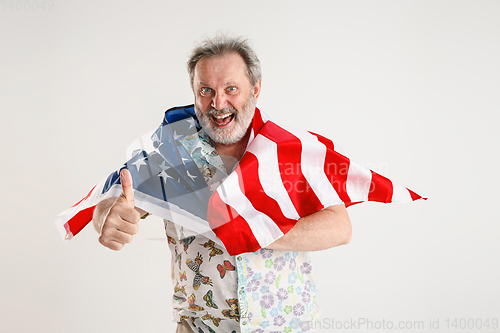 Image of Senior man with the flag of United States of America