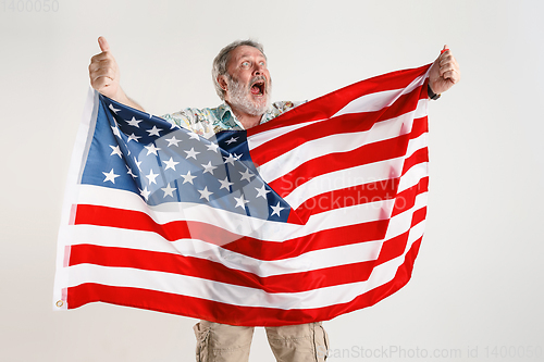 Image of Senior man with the flag of United States of America