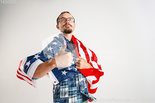 Image of Young man with the flag of United States of America