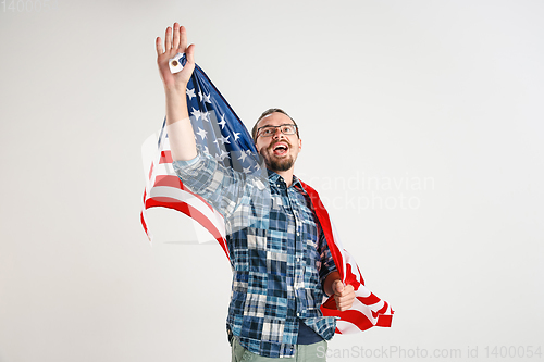 Image of Young man with the flag of United States of America