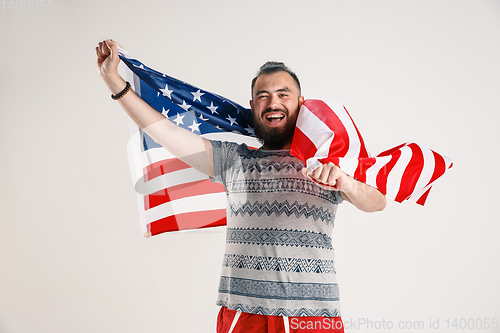 Image of Young man with the flag of United States of America