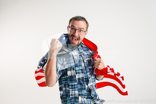 Image of Young man with the flag of United States of America