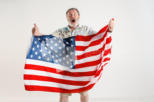 Image of Senior man with the flag of United States of America