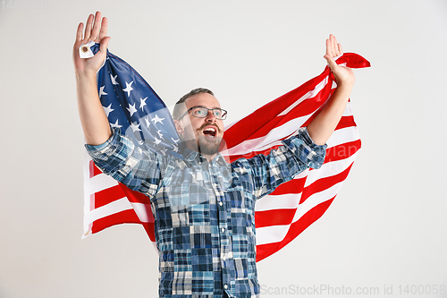 Image of Young man with the flag of United States of America