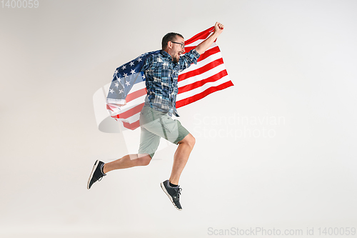 Image of Young man with the flag of United States of America