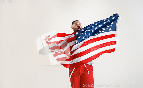 Image of Young man with the flag of United States of America