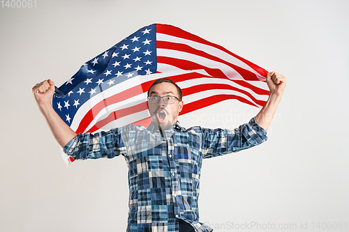 Image of Young man with the flag of United States of America