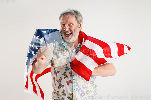 Image of Senior man with the flag of United States of America