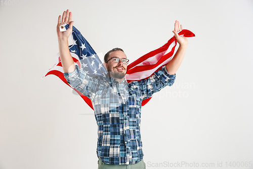 Image of Young man with the flag of United States of America