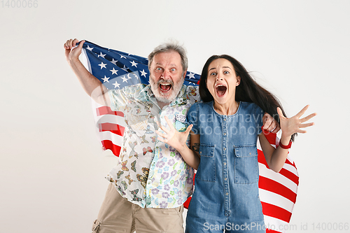 Image of Senior man with the flag of United States of America