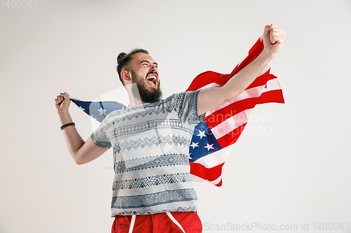 Image of Young man with the flag of United States of America