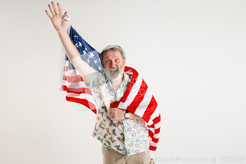 Image of Senior man with the flag of United States of America