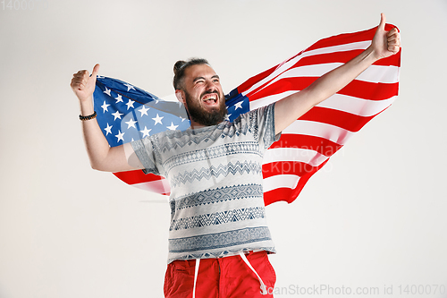 Image of Young man with the flag of United States of America