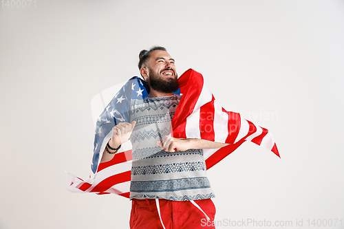 Image of Young man with the flag of United States of America