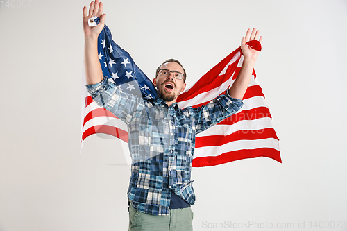 Image of Young man with the flag of United States of America