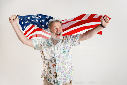 Image of Senior man with the flag of United States of America