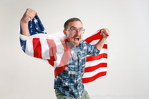 Image of Young man with the flag of United States of America