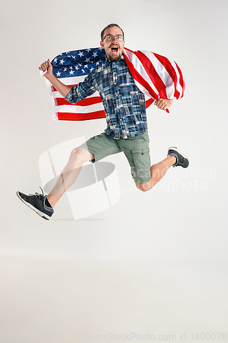 Image of Young man with the flag of United States of America