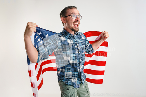 Image of Young man with the flag of United States of America