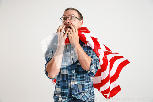 Image of Young man with the flag of United States of America