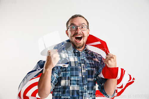 Image of Young man with the flag of United States of America