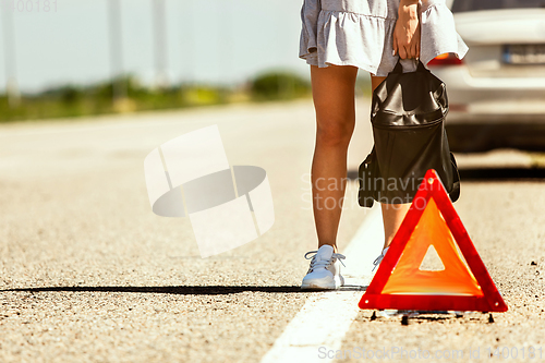 Image of Young couple traveling on the car in sunny day