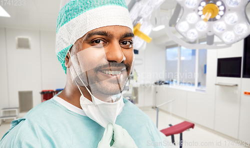 Image of smiling indian male doctor or surgeon at hospital