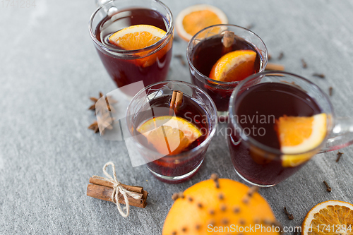 Image of glasses of mulled wine with orange and cinnamon